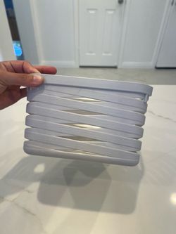 Small plastic container 8” long by 5” tall