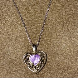 Sterling silver necklace with heart pendant. 