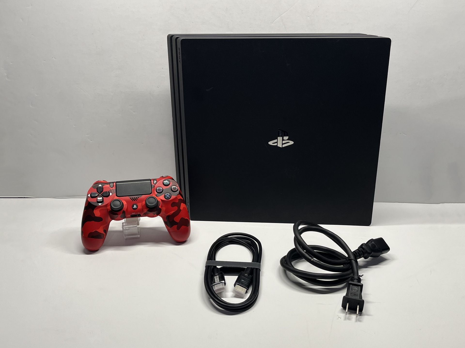 Ps4 pro 1Tb with red cami controller.