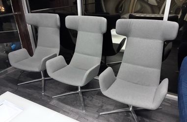 Upholstered swivel chairs in gray