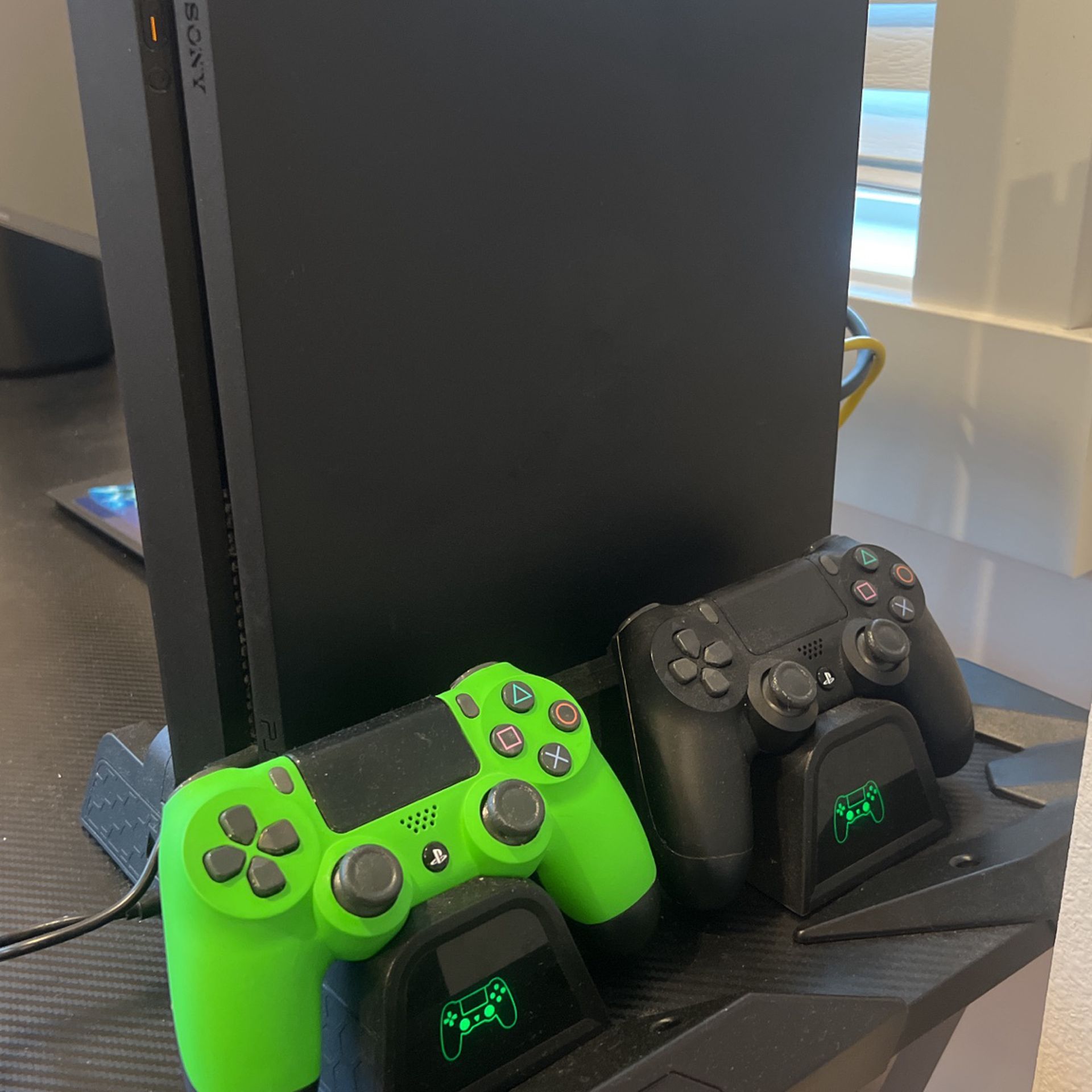 PS4 With 2 Controllers And A Charging Station