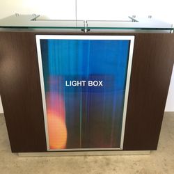Reception counter with a frosted glass top, wenge wood - Front Features A Backlit Logo Box