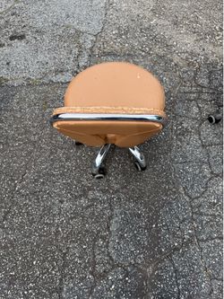 TAN SWIVEL CHAIR