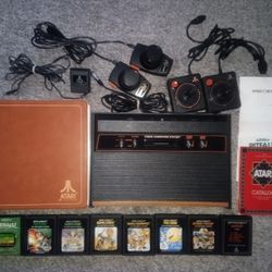 Atari 2600 Console Set With 8 Games Tested and Working + Storage Binder See Pics 