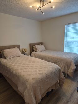 ALL NEW! 2 Twin XL beds with Mattresses + Mattress Pads. Never used.