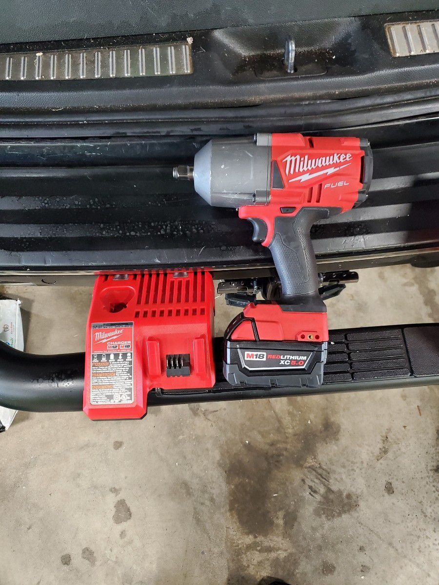 Milwaukee M18 FUEL Impact Wrench With Battery And Charger Used.