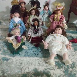 11 Old Porcelain Dolls