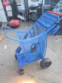 Price is firm.. Tommy Bahama beach cart with pull off ice chest..