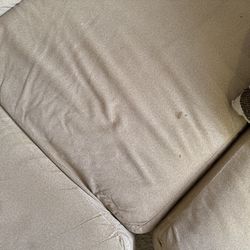 Brown L-Shaped Sectional with throw pillows