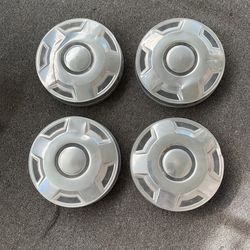 Ford "dog dish" or "bull nose"  HUBCAPS,  primarily used on Ford F-series pickup trucks, Broncos, and Econoline vans