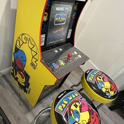 Pac-Man arcade machine with stools