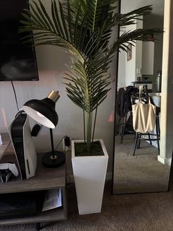 5-foot artificial palm tree in a white tall square planter