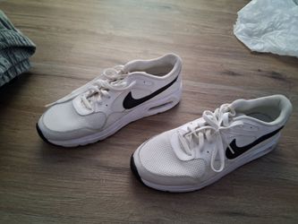 Nike Air Max SC Men's sneakers feature a clean white mesh upper with a distinct black