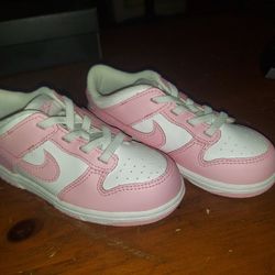 Nike Dunk Low baby/toddler shoes in white and medium soft pink. 
