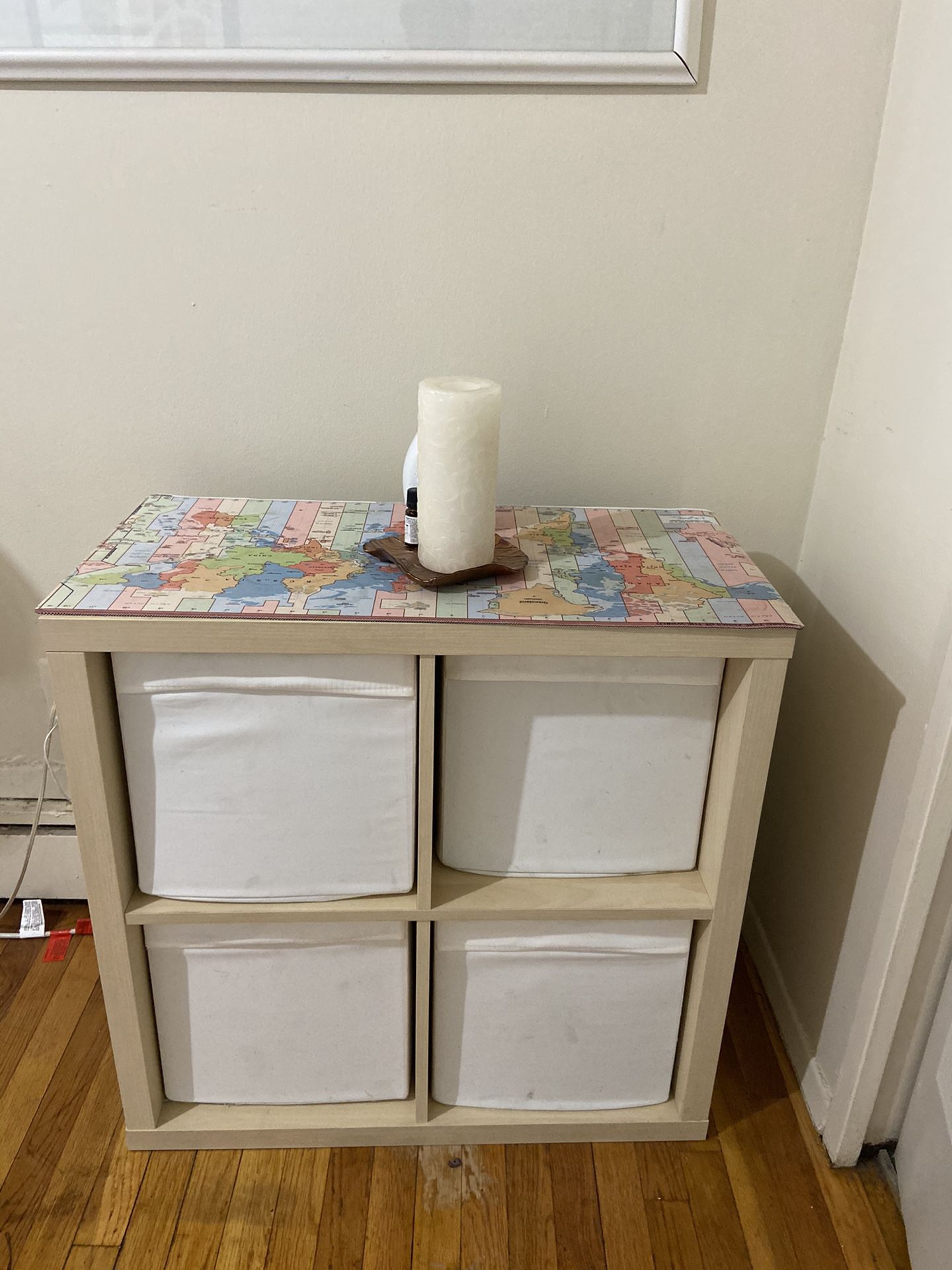 Cube storage cubbies with 4 white storage bins