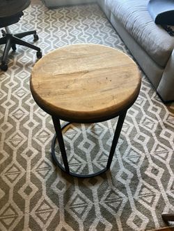Round wood and black metal side table