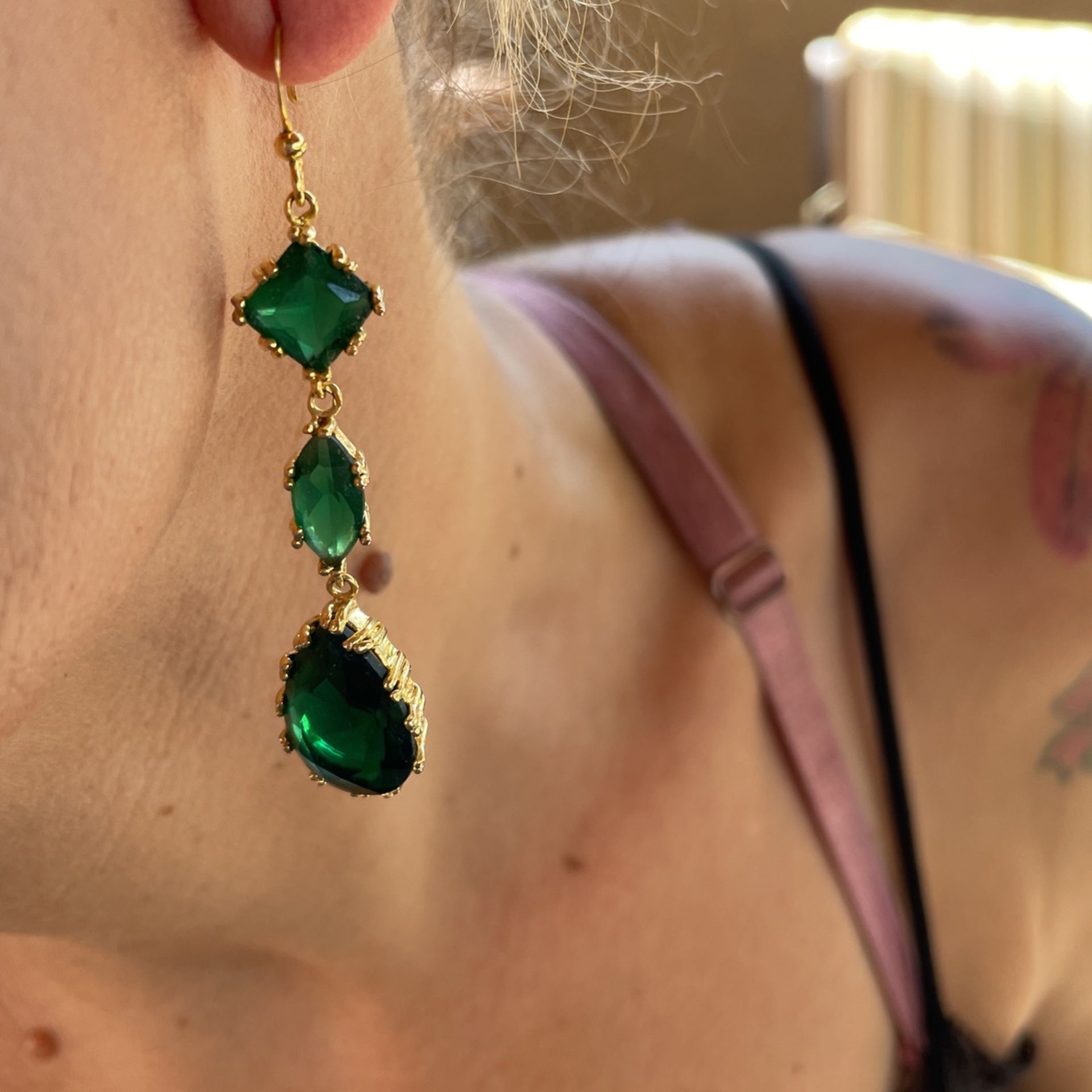 Three-tier emerald goldtone earrings face add I’m on my way to give her what I had I believe