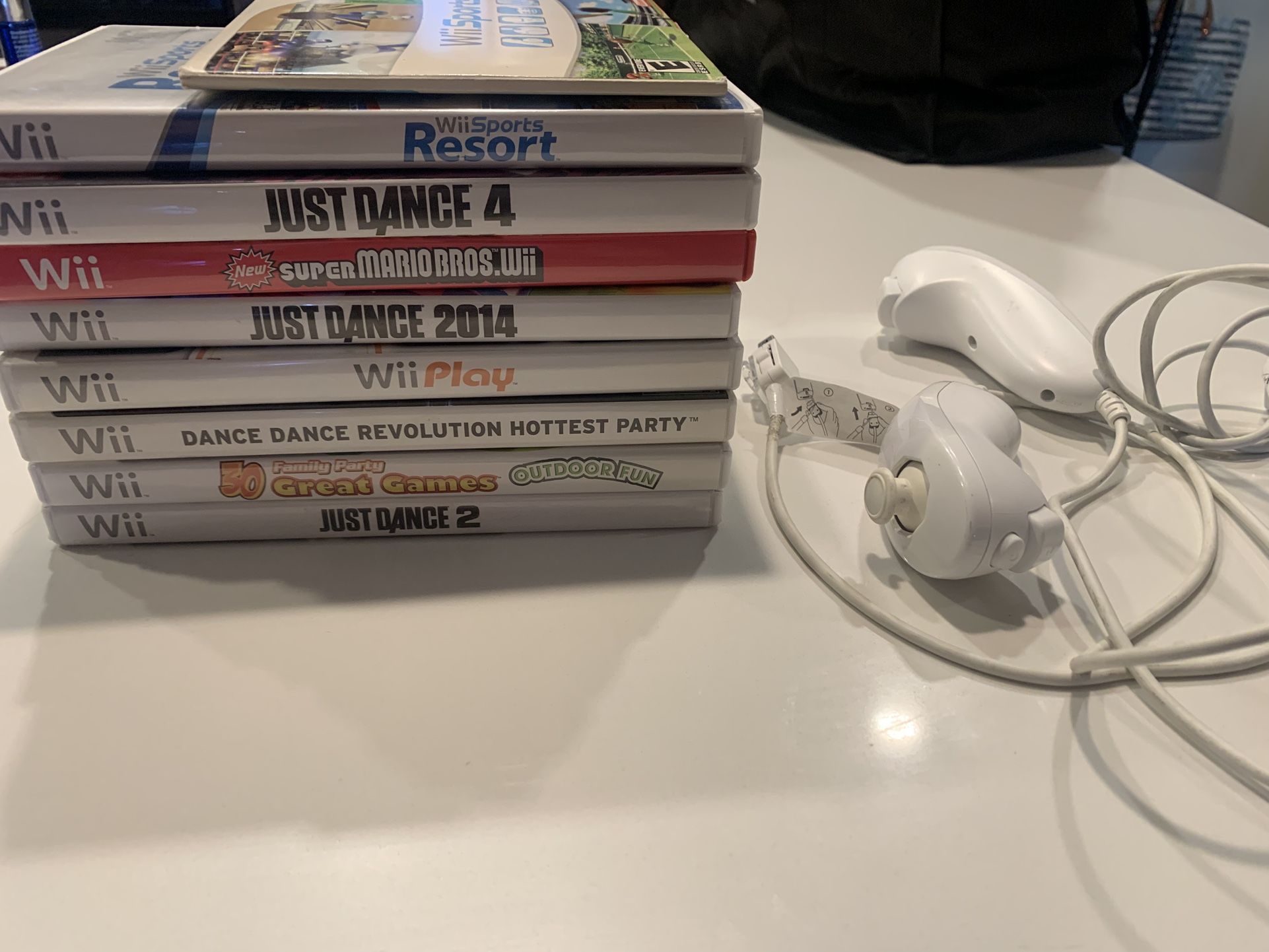 Wii Games & Two Nunchucks