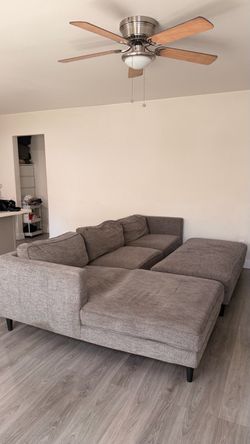 Living Spaces Sectional + Ottoman — $400