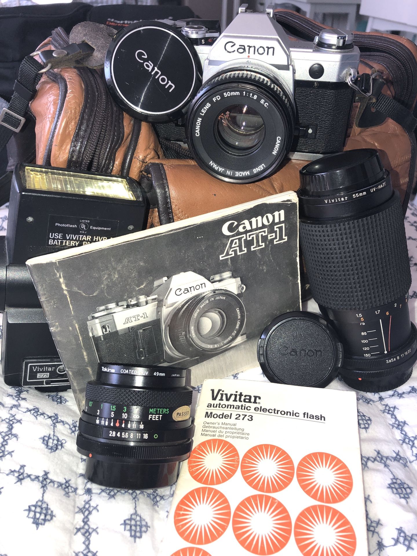 Canon camera with flash and additional lenses