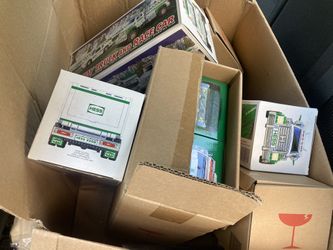 Unopened Hess Trucks And Race Car Sets