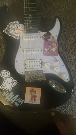 Black Electric Guitar with Stickers