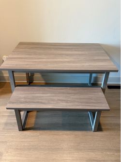 Grey dinner table with bench