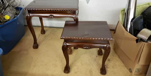 2 solid wood end tables that fit together.