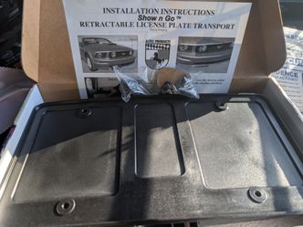 Retractable license plate holder