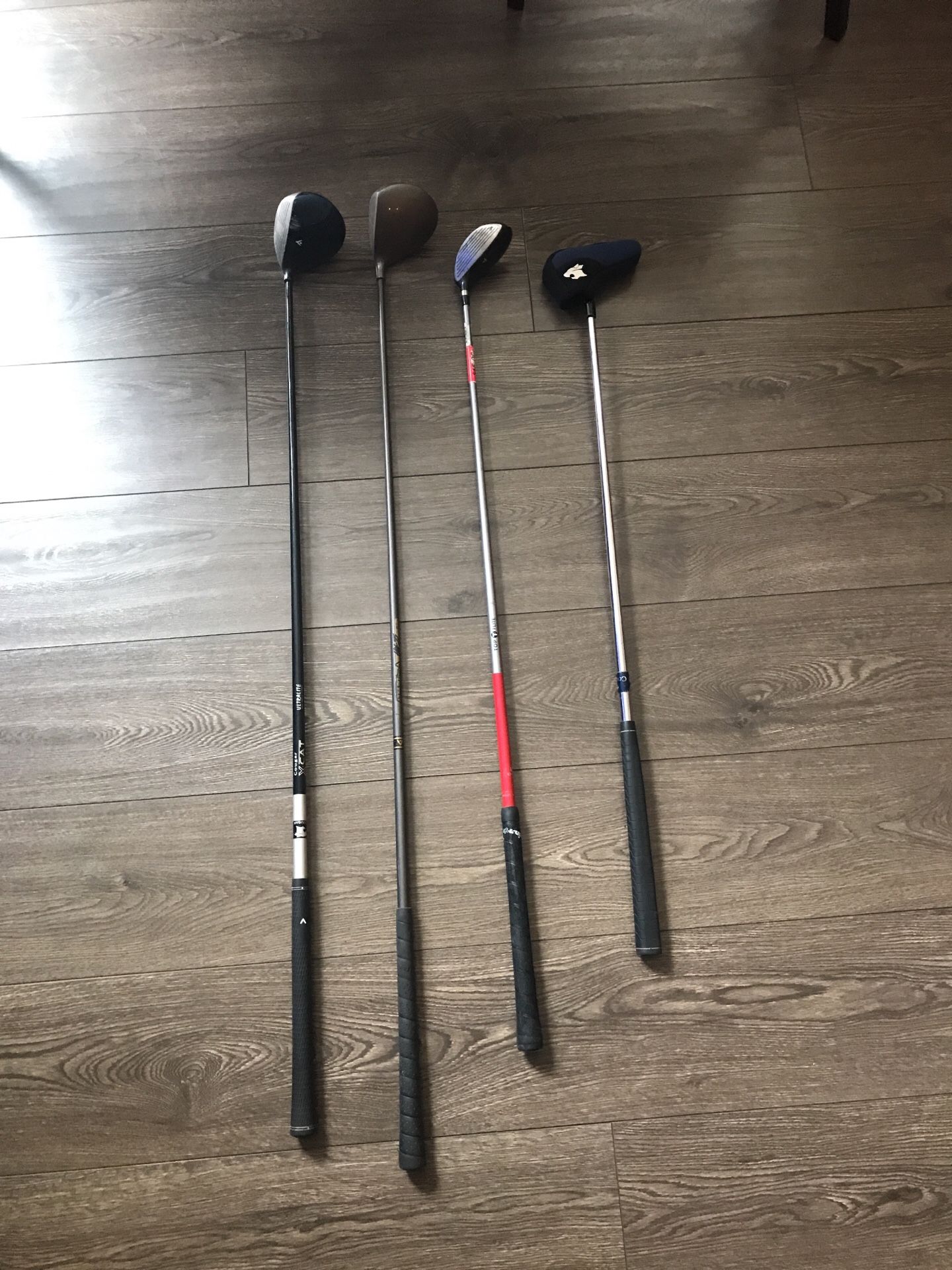 Assortment of used golf clubs (DR, 3w, 5w, Putter)