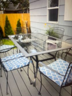 Patio dining set- 6 nice glass/6 iron chairs w/cushions