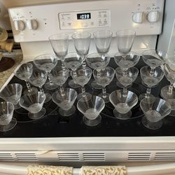 Vintage crystal stemware circa 1940s Very lightweight and fragile.  25 pieces total. These belonged to my grandmother who was born in 1908. Smoke and 