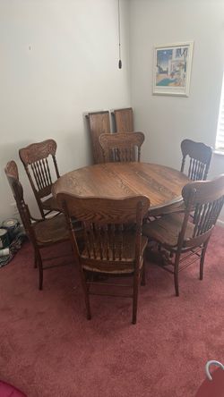 Round Oak Pedestal Dining Table with Claw Feet