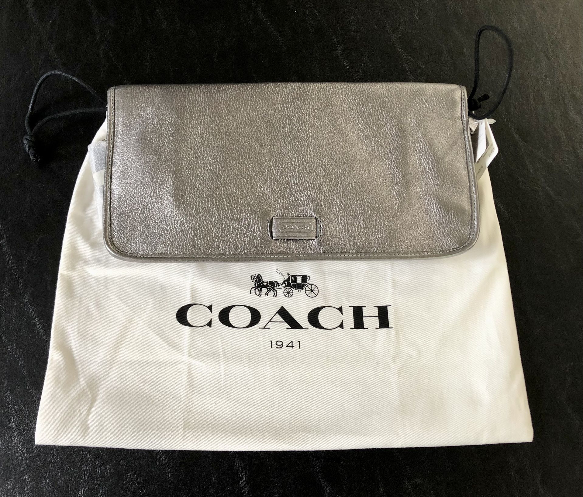 New Coach Gunmetal color leather flap clutch purse