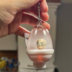 Tsunameez Skibidi Toilet liquid-filled blind bag keychain featuring a character inside a toilet-shaped capsule