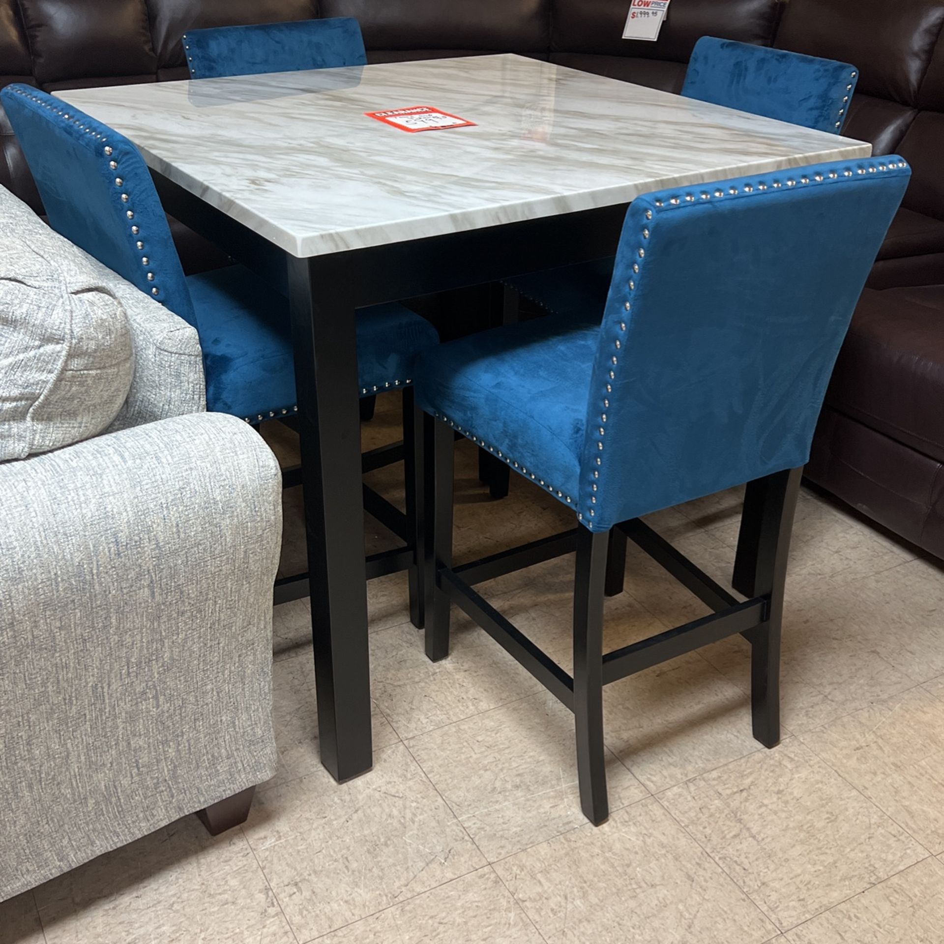 Brand new 36 inch high table and four stools for 599