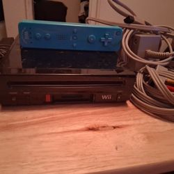 Black Nintendo Wii and Blue Wii Plue Remote 2006