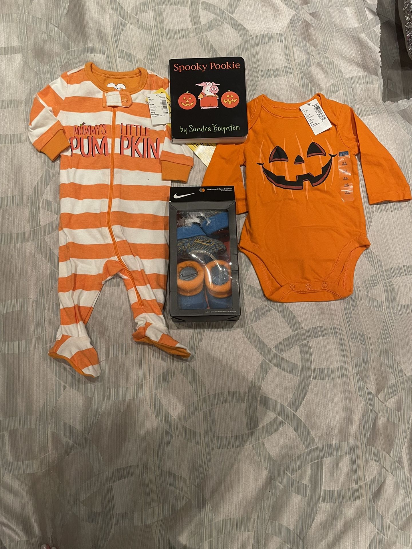 New - 4 piece Halloween baby Gift bundle Pajamas, onesie, bootie socks, book 