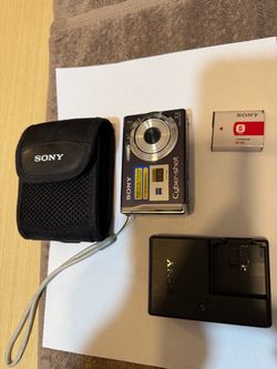 Compact Sony Cyber-shot DSC-W80 digital camera in black. This 7.2 megapixel camera has a Carl Zeiss Vario-Tessar lens and a 2.5-inch LCD screen. It co