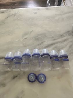 7 Lansinoh Baby Bottles (Four 5oz and Three 8oz) + 2 extra nipples