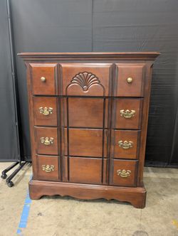 Traditional Dark Wood Dresser with Ornate Hardware