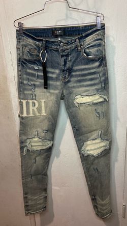 Amiri Distressed Jeans with Logo Patch
