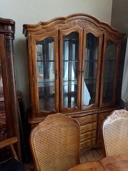 China hutch and dining room table with chairs