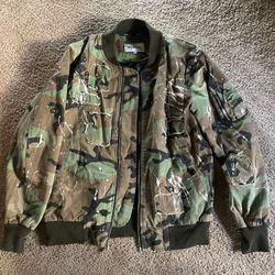 Reason distressed camo bomber jacket