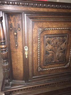 Beautiful antique Armoire with cherub latch , drawer and shelves inside