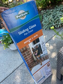 Pet safe door for slider