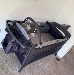 Kinder King 4-in-1 Portable Pack and Play with Bassinet, Changing Table, Adjustable Canopy, Storage Basket & Travel Bag – Infant to Toddler Playard