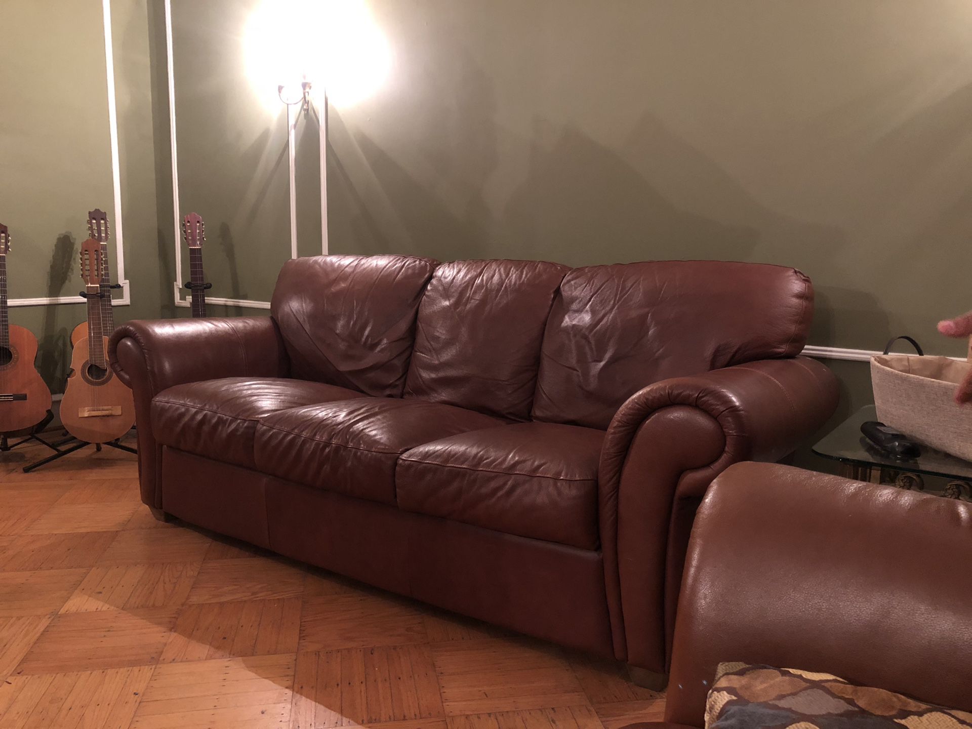 Leather sofa bed, love seat, chair, and ottoman