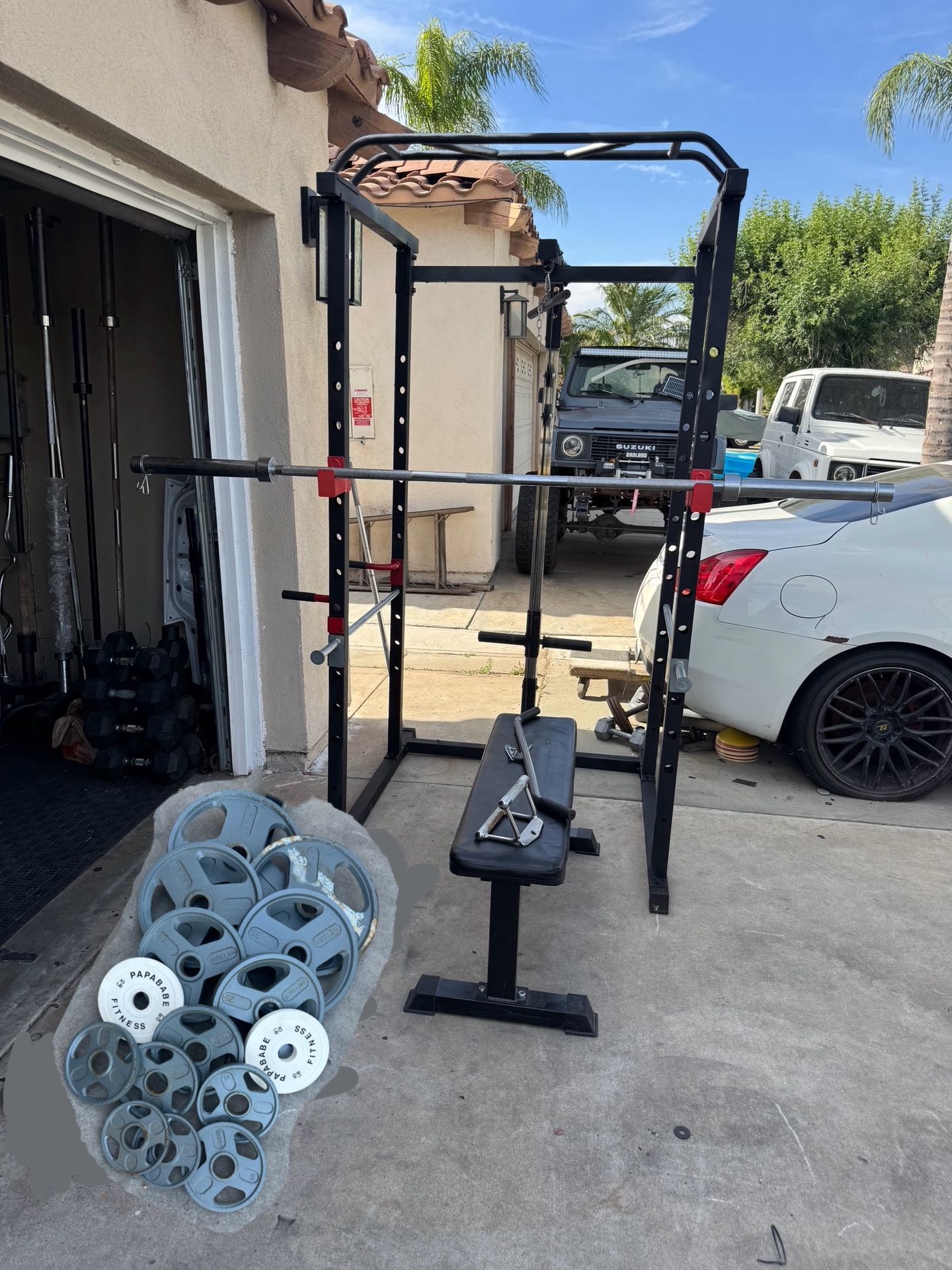 Bench press/squat rack with 7ft bar plus 265lbs of Olympic weights