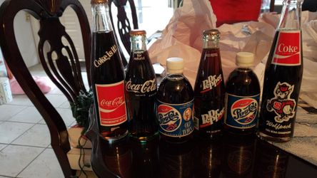 Very old Pepsi and cola bottles